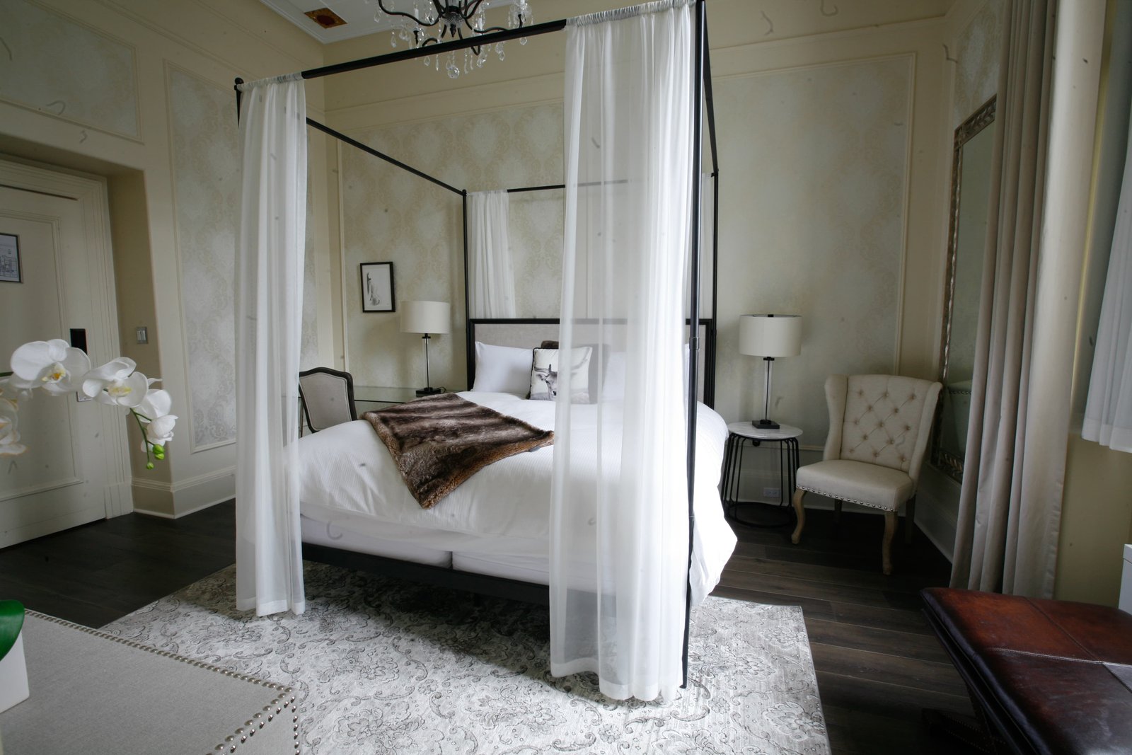 Canopy bed with white draping interior design — Parishi Design Studio Toronto